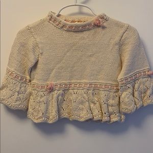 Baby sweater cream with pink accents